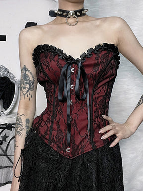 Burgundy strapless corset top with black floral lace shown in a cropped front outfit view.