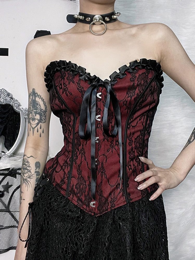 Burgundy strapless corset top with black floral lace shown in a cropped front outfit view.