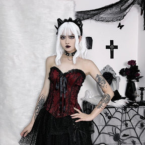 Burgundy strapless corset top with black floral lace shown in a full styled outfit.