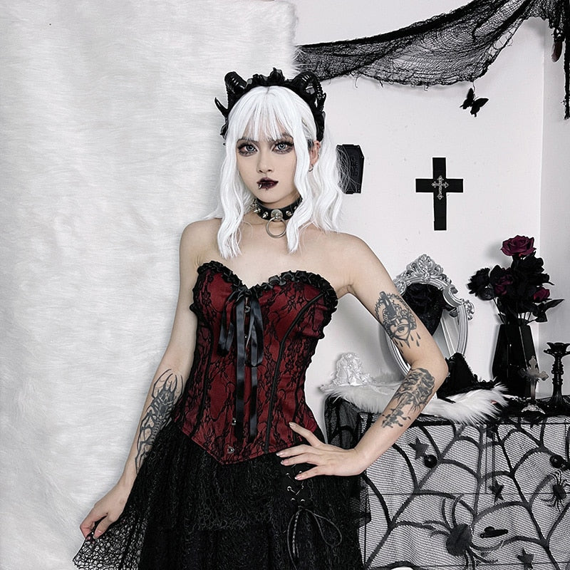 Burgundy strapless corset top with black floral lace shown in a full styled outfit.