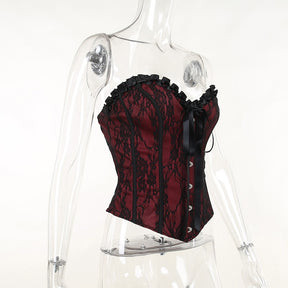 Burgundy strapless corset top with black floral lace displayed at an angle on a mannequin.