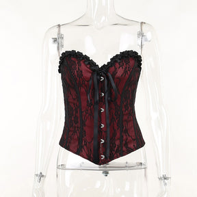Burgundy strapless corset top with black floral lace displayed from the front on a mannequin.