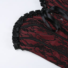 Burgundy strapless corset top with black floral lace with a close view of the ruffled neckline and ribbon bow.