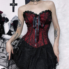Burgundy strapless corset top with black floral lace styled with a separate black skirt.