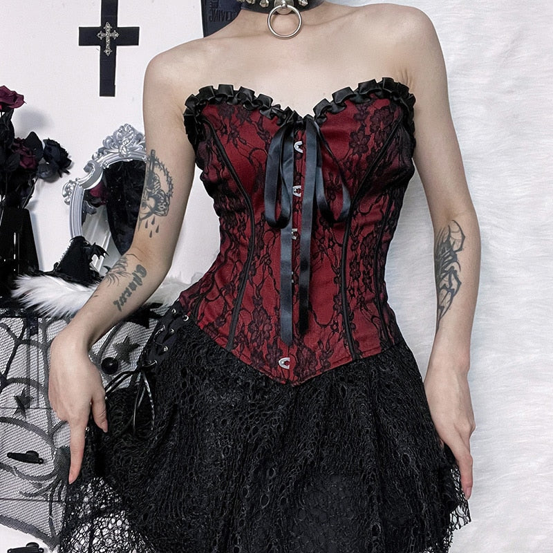 Burgundy strapless corset top with black floral lace styled with a separate black skirt.