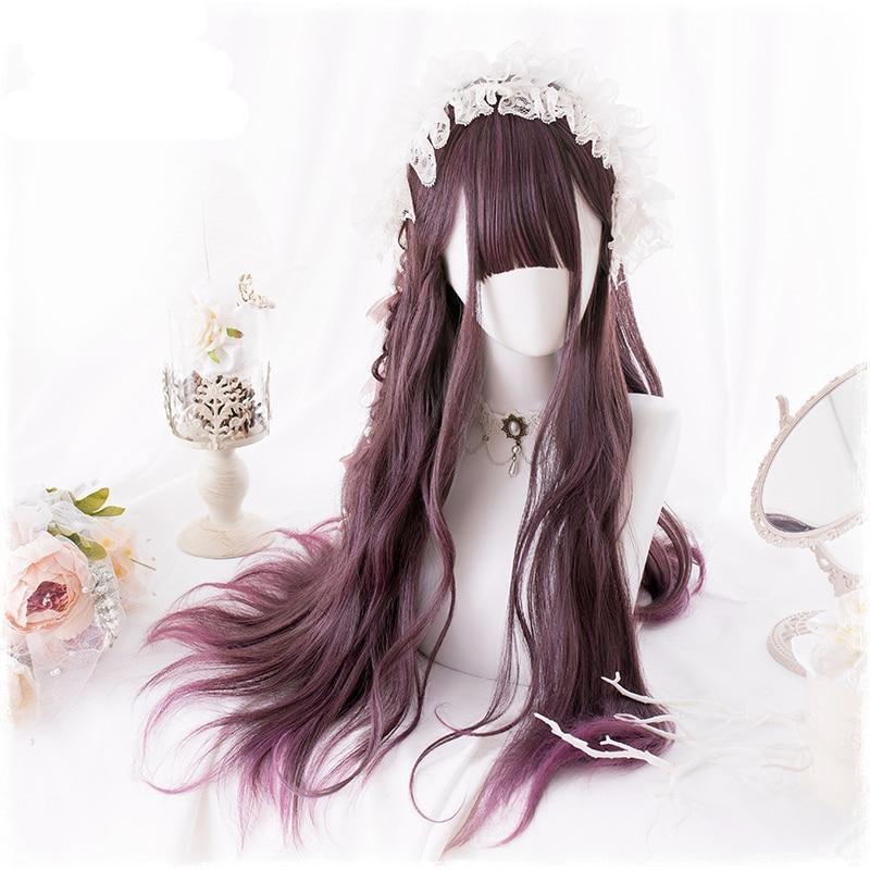Long burgundy wavy wig viewed from the front on a white mannequin. Full bangs, a small side braid and a white lace headpiece frame the face above the flowing lengths.