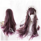 Front and back views of a long burgundy gothic wig on white mannequin heads. Loose waves fall below the shoulders, with full bangs and a white lace headpiece in the styled front view.