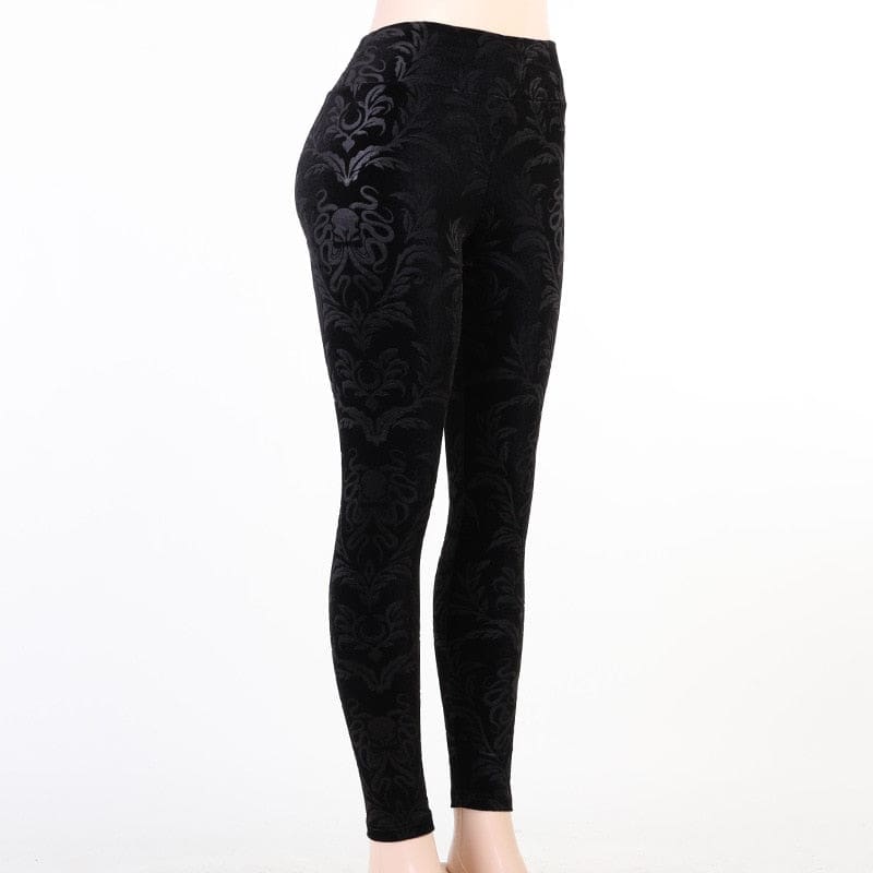 Angled display of the black patterned pants on white, showing the high waistband and close fit through the thighs.