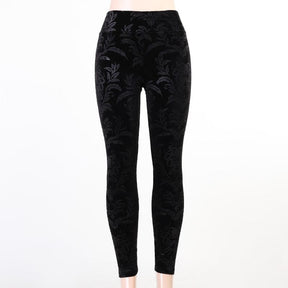 Black Cameo velvet skinny pants displayed against white, showing the full front pattern and tapered-looking fitted leg outline.