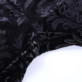 Detailed view of the pants’ central seams and tonal scrolling velvet pattern.