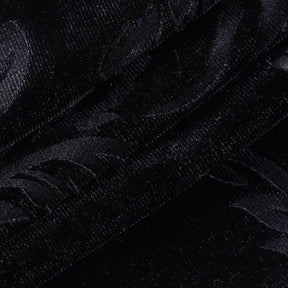 Macro view of the black velvet fabric, showing its short pile and subtle patterned surface.