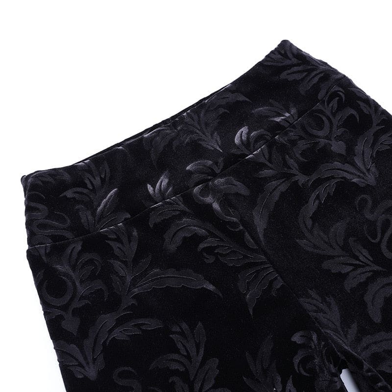 Close view of the broad waistband and central seam on the black Cameo velvet pants.