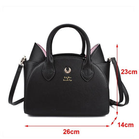 Measurement guide for the black cat-ear handbag, showing a width of 26cm, height of 23cm and depth of 14cm beside the bag.