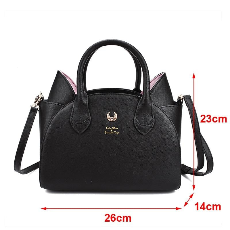Measurement guide for the black cat-ear handbag, showing a width of 26cm, height of 23cm and depth of 14cm beside the bag.