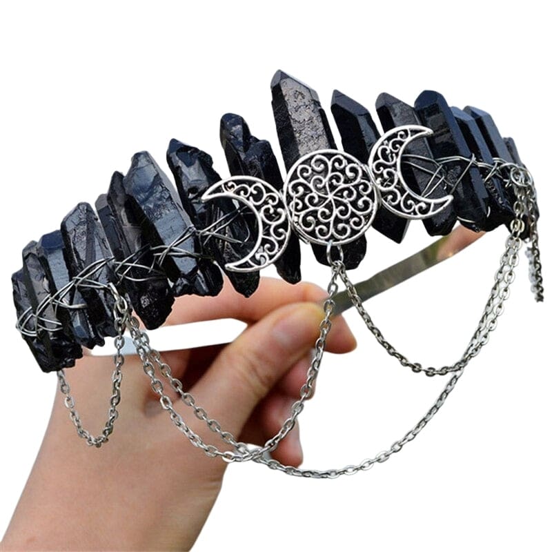 Black crystal-point crown with silver-tone triple moons and draped chain swags.