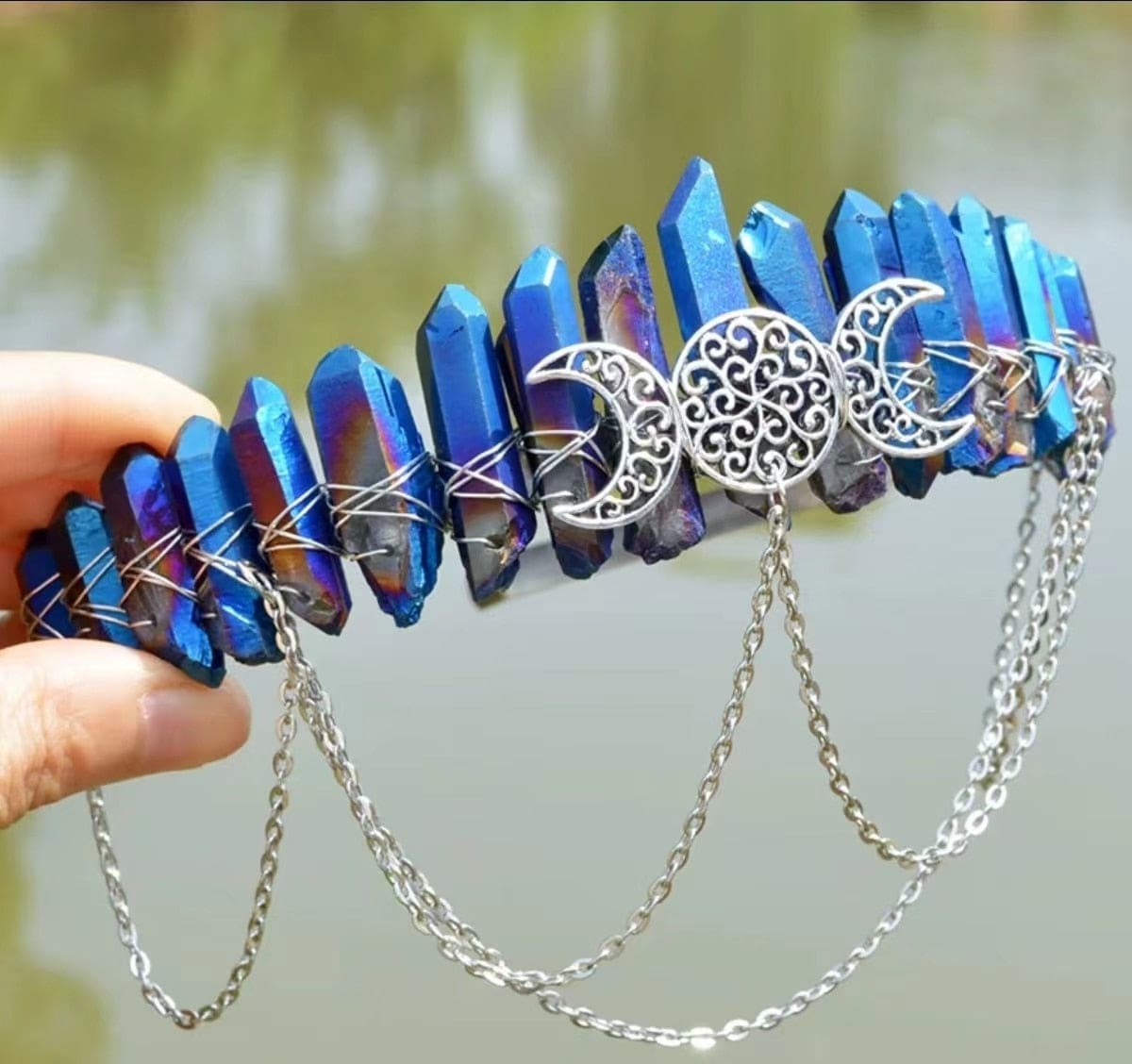 Cobalt blue pointed stones on a silver-tone triple-moon goddess crown.