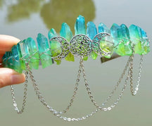 Green and turquoise gradient crystal points on a triple-moon goddess crown with chains.