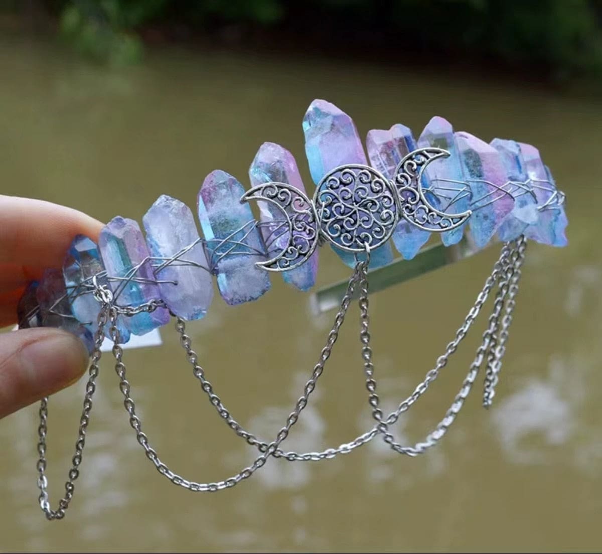 Lavender crystal-point crown with iridescent highlights and a silver-tone triple-moon centerpiece.