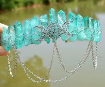 Mint-green crystal crown with three ornate moons and silver-tone chain swags.