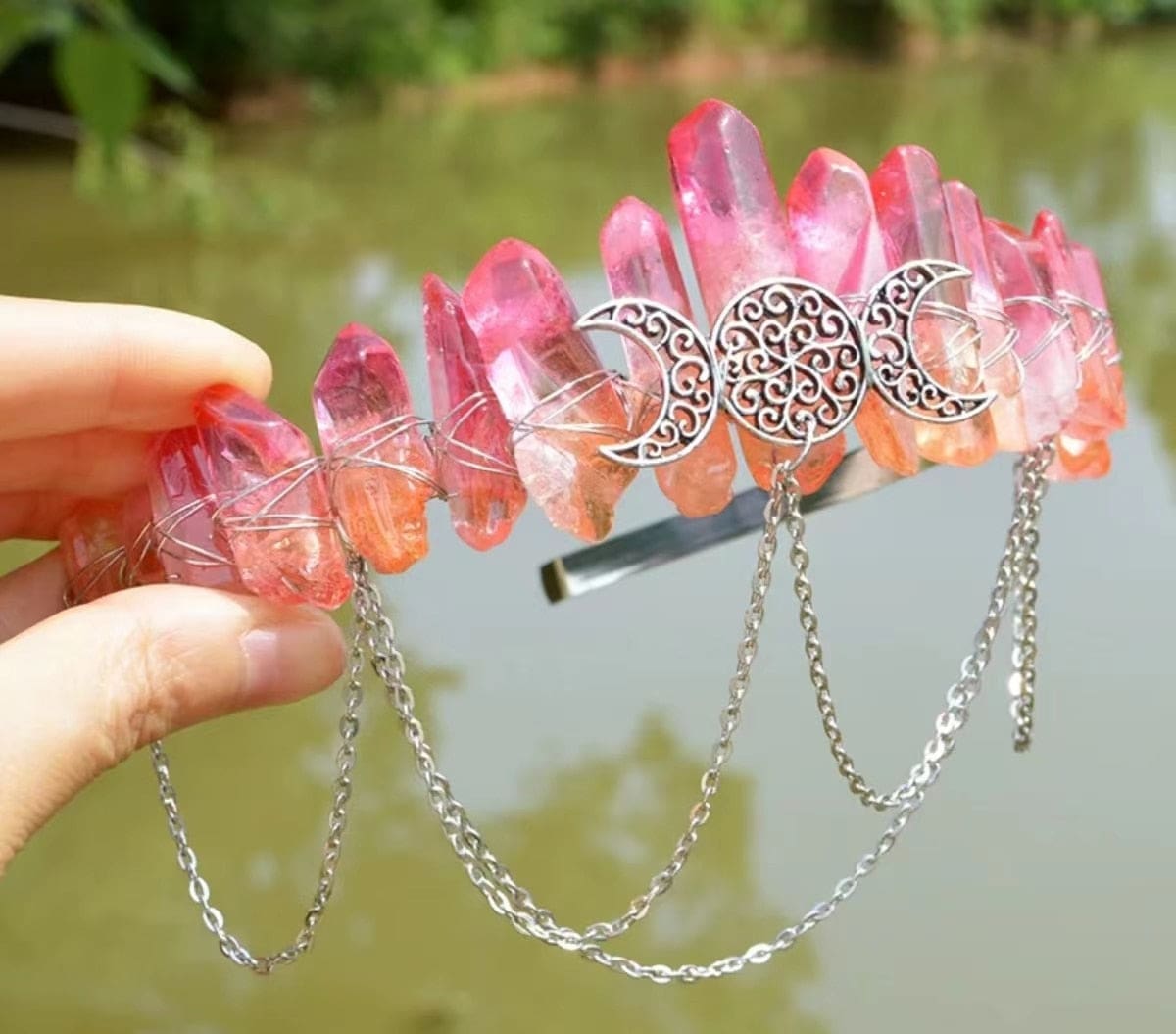 Pink-to-clear gradient crystal crown with an ornate triple moon and hanging chains.