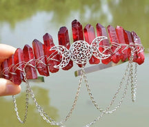 Red pointed stones wrapped with silver-tone wire on a chained triple-moon crown.