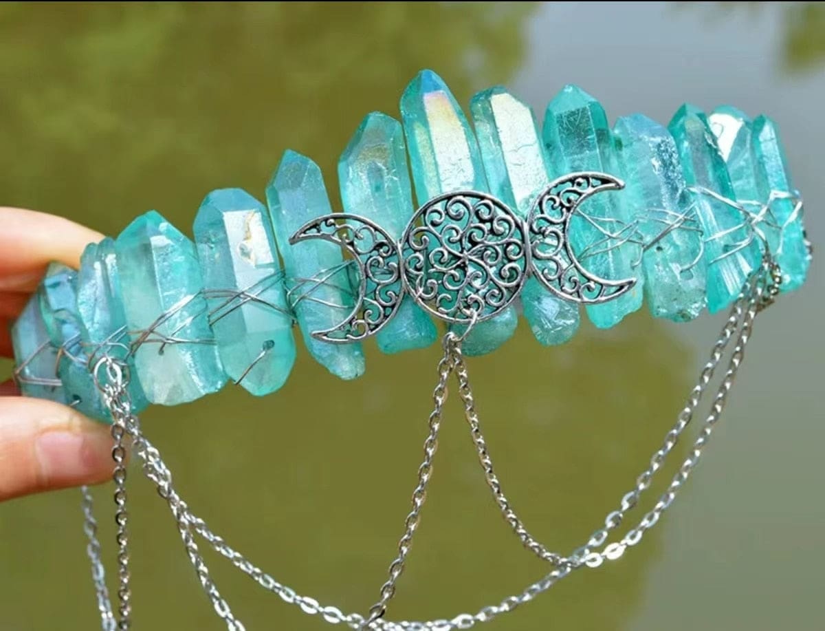 Turquoise crystal-point crown with iridescent highlights, wire wrapping and draped chains.