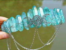Turquoise crystal-point crown with iridescent highlights, wire wrapping and draped chains.