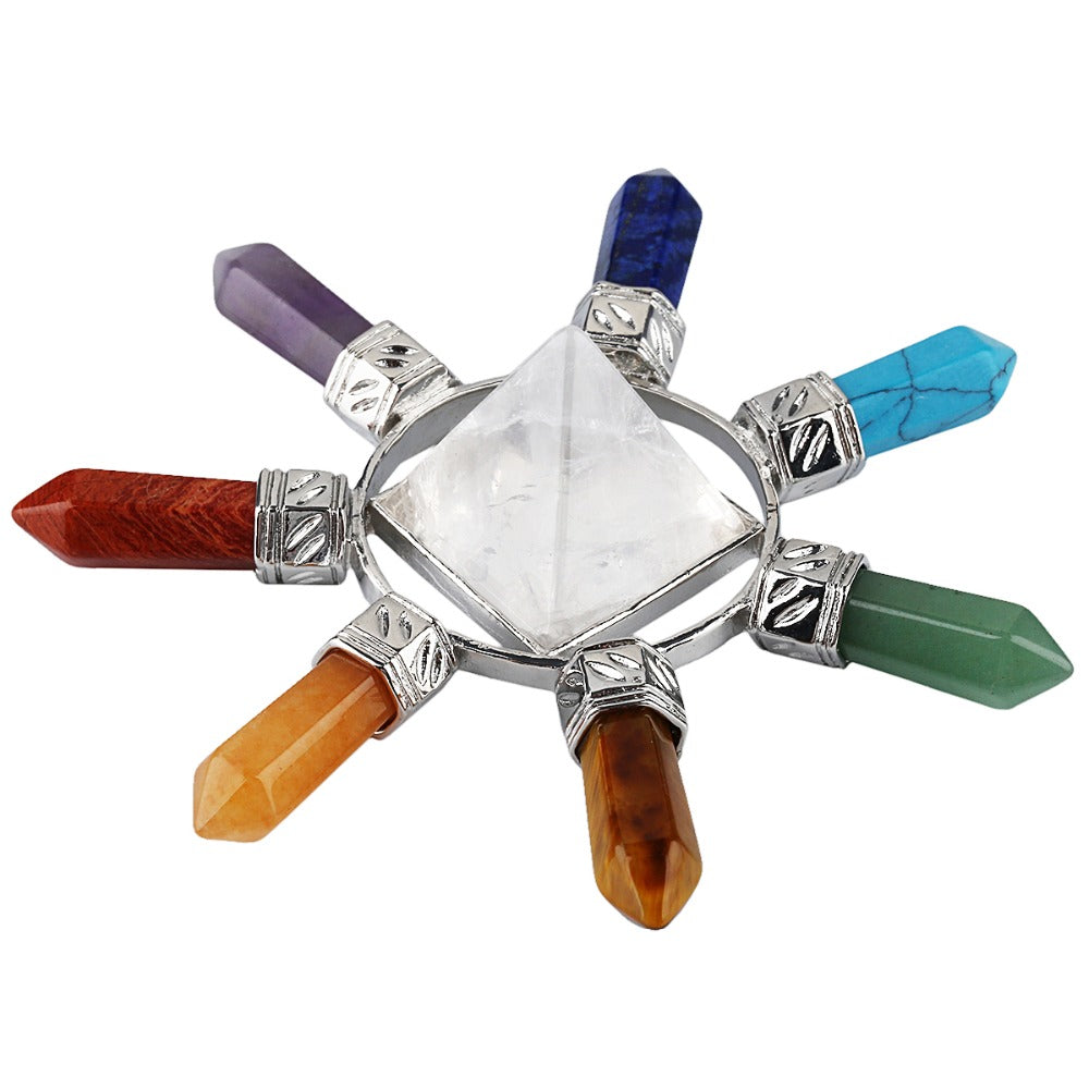 Side view of the crystal arrangement showing the raised clear pyramid above the surrounding points and connecting metalwork.