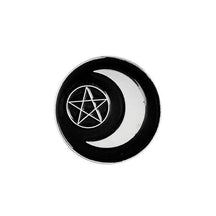 Black crescent-moon pin surrounding a silver-tone outlined pentagram within a circle.