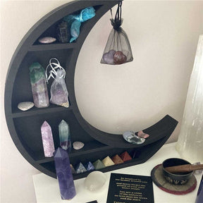 Crescent shelf styled with incense and cup