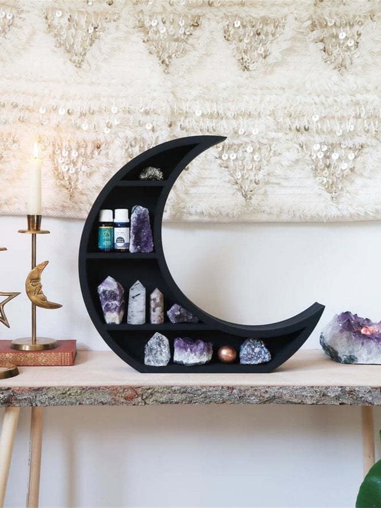 Crescent moon crystal shelf styled on a console