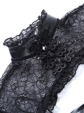 Detail of the overlay's high black collar, scalloped lace trim and ornamental front fastenings.