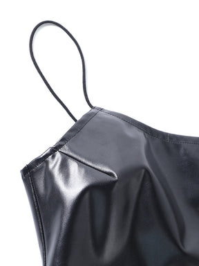 Detail of a thin black shoulder strap and the fitted seam below the mini dress neckline.