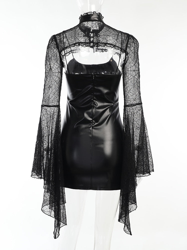 Rear mannequin view of the dress-and-overlay set, showing the exposed upper back between the dress and shoulder lace.