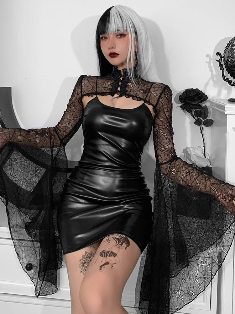 Dark Abyss dress and lace overlay worn with arms extended, displaying the pointed sleeve drapes and fitted black mini skirt.
