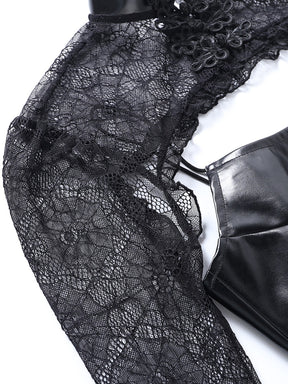 Close view of the web-patterned lace shoulder and scalloped lower edge beside the black dress strap.