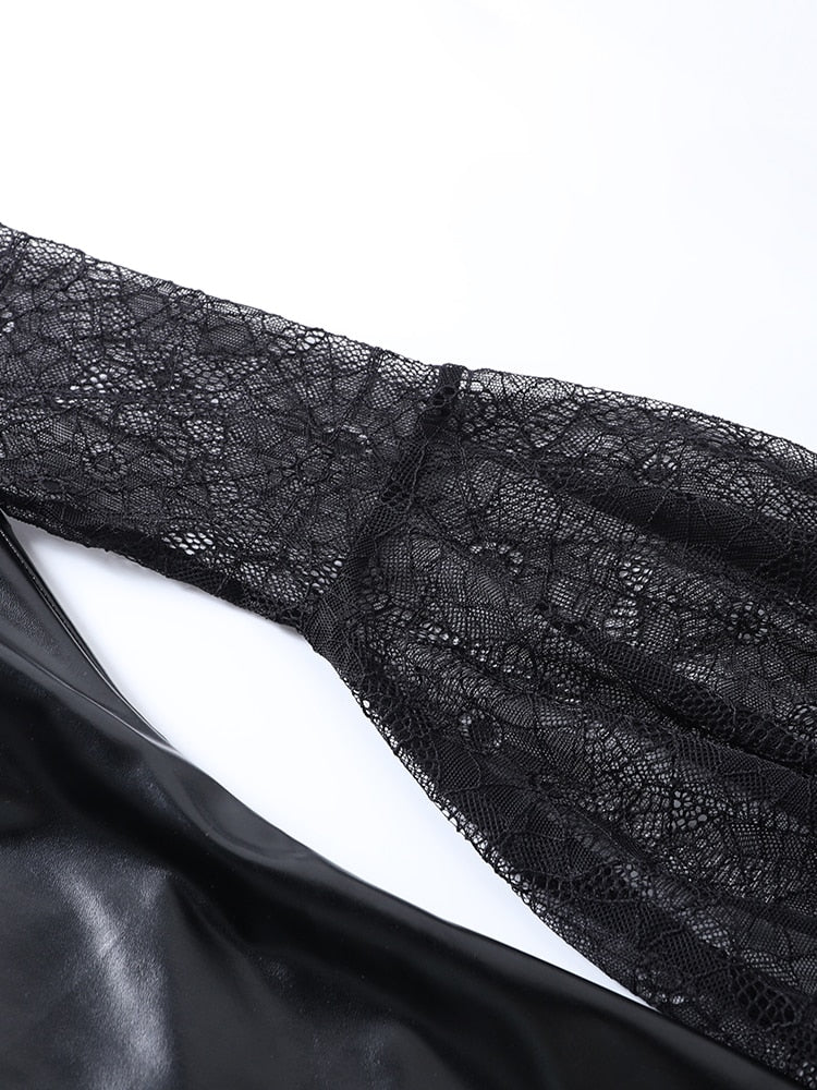 Spiderweb lace sleeve laid flat beside the glossy black dress, showing the fitted upper arm and flared lower section.