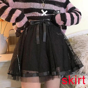 Black dotted skirt with a sheer outer layer and a large waist bow, styled under a pink striped sweater. Red text identifies the skirt-only option.