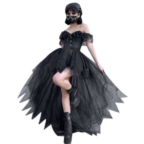 Model cutout against white wearing the black high-low tutu skirt with one leg lifted, revealing the short front and long back layers.