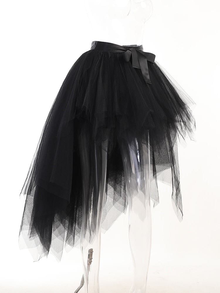 Black layered tutu skirt on a transparent display form, showing the shorter front and cascading longer panels from an angle.