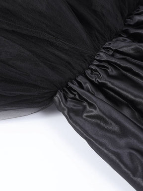 Interior waist detail of the black tutu skirt, showing the gathered band and the layered fabric beneath it.