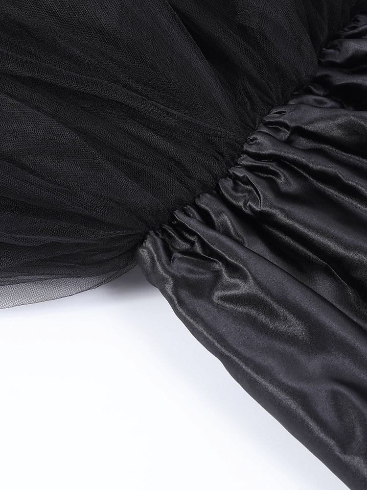 Interior waist detail of the black tutu skirt, showing the gathered band and the layered fabric beneath it.