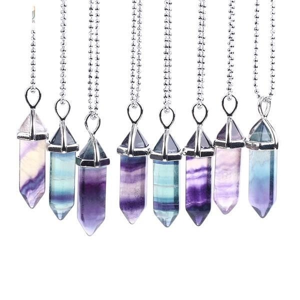 A group of fluorite point pendants with silver-tone caps and beaded chains, showing varied green and purple bands.