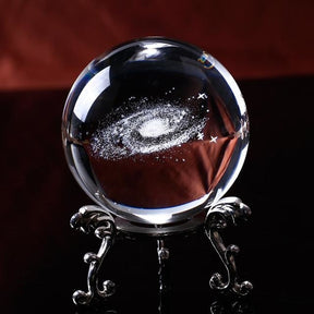 Additional copy of the silver-tone stand view, showing the white galaxy spiral suspended-looking within the clear ball.