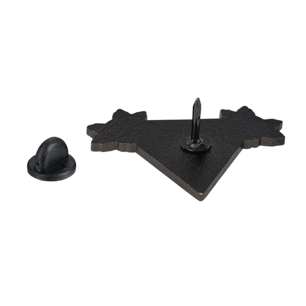 Back of the black Girl Power triangle pin showing its single post, with the removable black rubber clutch placed beside it on white.