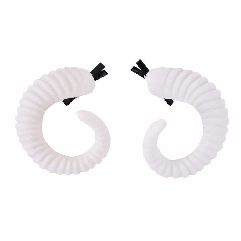 Curled ram horn hair clips with ridged detailing, available in black or white with plain or red rose designs