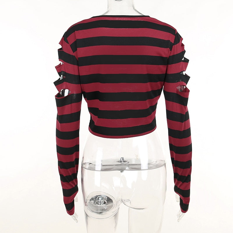 Back view of the red and black striped sweater on a clear mannequin, showing an uncut back panel and slashes at the upper sleeves.
