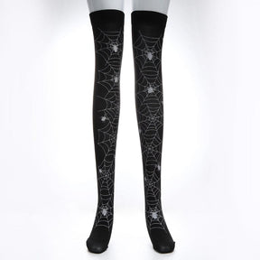 Alternate isolated view of black thigh-high stockings with pale web patterns.