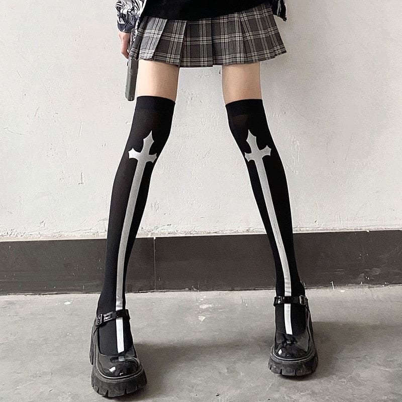 Black thigh-high stockings with tall white crosses, styled with a plaid skirt.