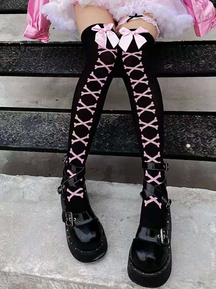 Black thigh-high stockings with pink crossed bones and large pink bows at the tops.